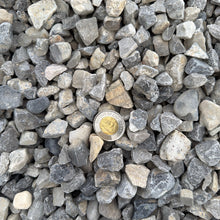 Load image into Gallery viewer, Close-up of small stones with a gold coin embedded in them