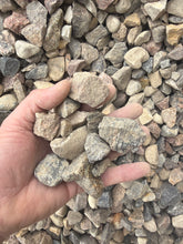 Load image into Gallery viewer, Hand holding small stones amidst a pile of gravel