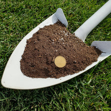 Load image into Gallery viewer, A shovel full of brown garden soil mix, with a coin used for scale, placed on a green grass surface.