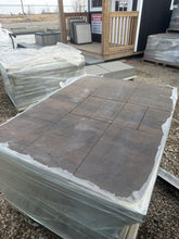 Load image into Gallery viewer, Stack of stone tiles with a building exterior in the background
